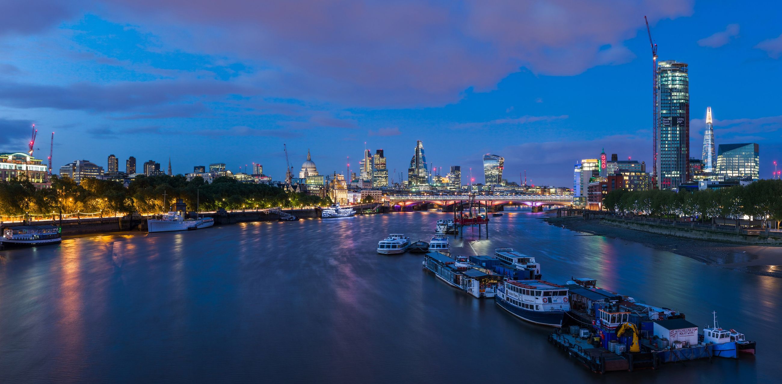 The London skyline at dusk, photographed from Waterloo Bridge