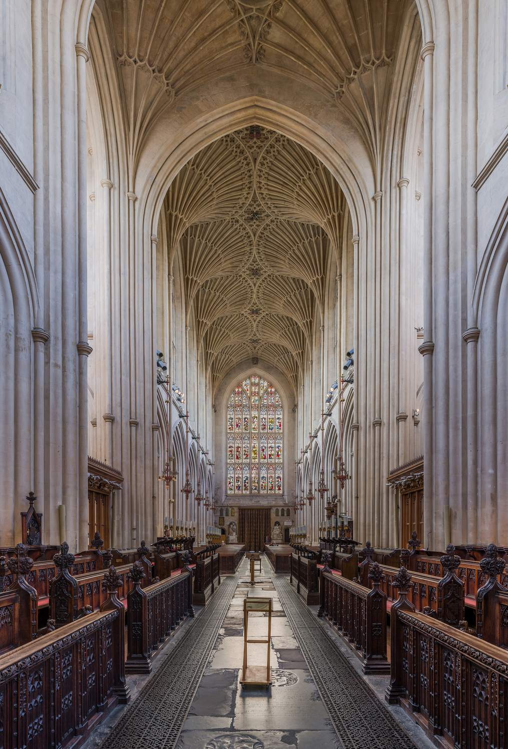 The long nave of Bath Abbey under its pale stone fan vaulting.