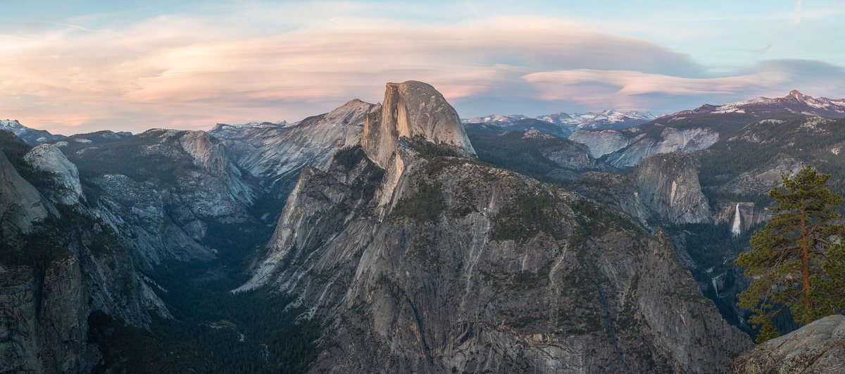 Half Dome and the High Sierra glowing in the last light of sunset, seen from Glacier Point.