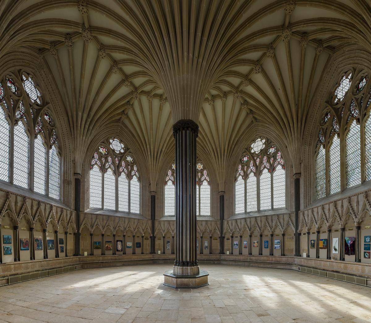The fan of stone ribs springing from the central column of the Chapter House at Wells Cathedral.